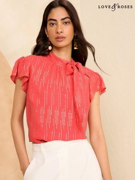 Love & Roses Pink Metallic Flutter Sleeve Tie Neck Blouse (204437) | € 55