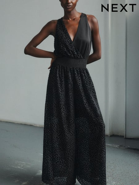 Black Premium Halter Neck Animal Print Flocked Jumpsuit (381262) | € 38