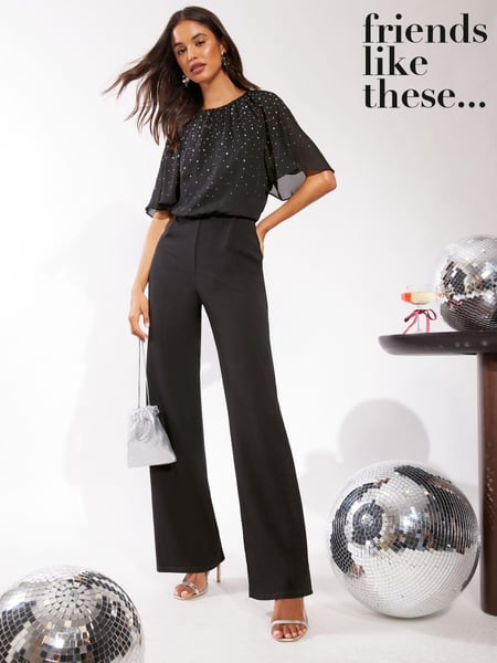 Friends Like These Black Sparkly Chiffon Short Flutter Sleeve Jumpsuit (B71304) | € 64