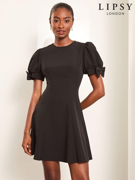 Lipsy Black Bow Detail Puff Sleeve Skater Mini Dress (E04622) | € 49