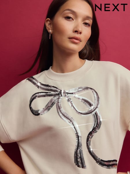 Ecru/Silver Christmas Sparkle Sequin Front Bow Graphic Crew Neck Sweatshirt (E14007) | € 19