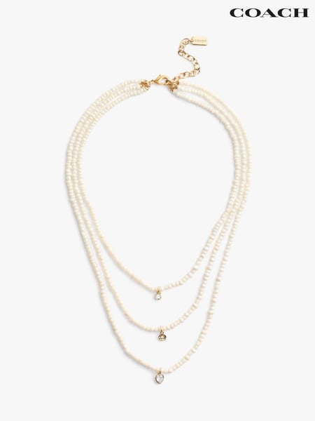 COACH Gold Tone Pearl Multilayer Charm Necklace (F02489) | € 273