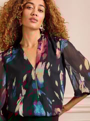Love & Roses Black Abstract Petite Zip Front Mix Sheer Long Sleeve Length Blouse - Image 2 of 4