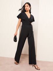 Friends Like These Black Petite Short Frill Sleeve Scuba Wrap Jumpsuit - Image 1 of 4