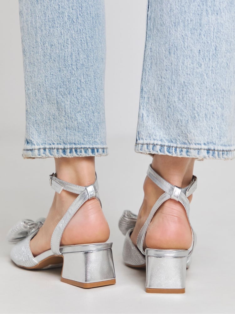 Simply Be Silver Wide Fit Low Heel Bow Occasion Sandals In Extra Wide Fit - Image 1 of 5 Simply Be Silver Wide Fit Low Heel Bow Occasion Sandals In Extra Wide Fit - Image 1 of 5