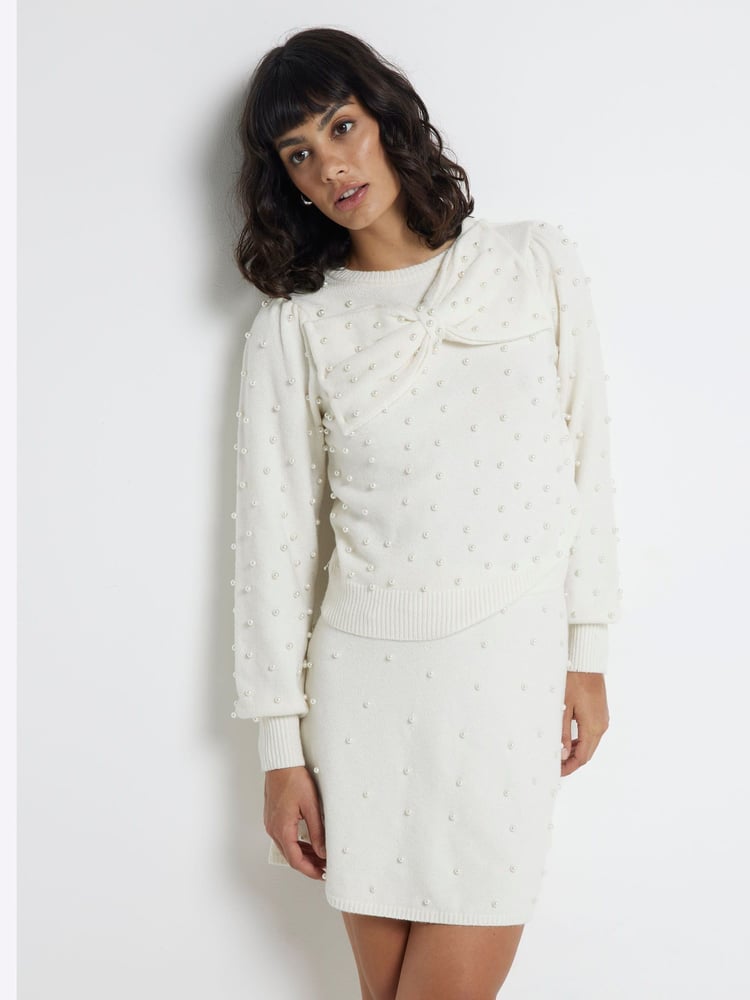 River Island Cream Bow Pearl Crew Neck Jumper - Image 1 of 6 River Island Cream Bow Pearl Crew Neck Jumper - Image 1 of 6