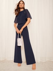 Friends Like These Navy Blue Petite Chiffon Flutter Sleeve Wide Leg Jumpsuit - Image 1 of 4
