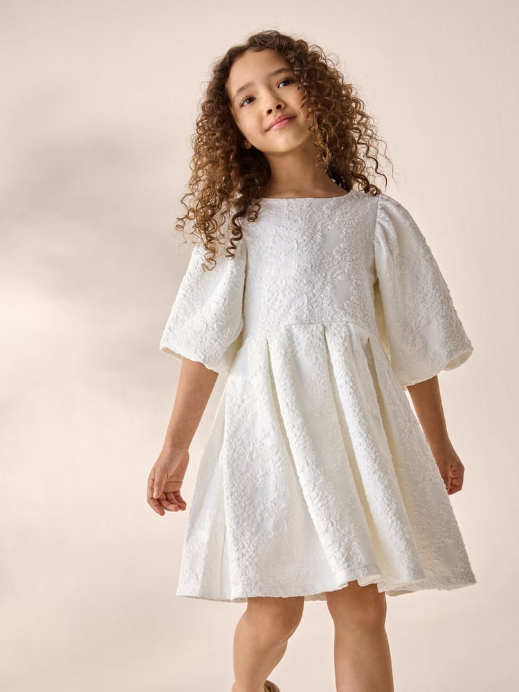 Cream Textured Puff Sleeve Occasion Dress (3-16yrs) - Image 1 of 6 Cream Textured Puff Sleeve Occasion Dress (3-16yrs) - Image 1 of 6