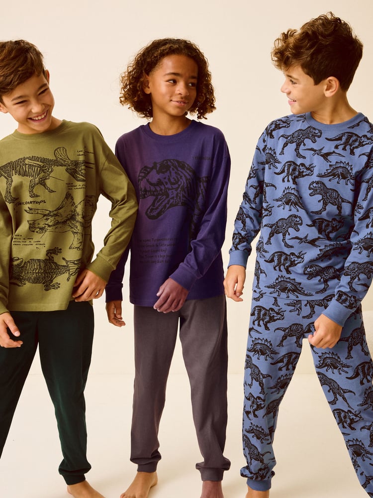 Olive Green/Blue/Purple Dinosaur 3 Pack 100% Cotton Long Sleeve Pyjamas (3-16yrs) - Image 1 of 11 Olive Green/Blue/Purple Dinosaur 3 Pack 100% Cotton Long Sleeve Pyjamas (3-16yrs) - Image 1 of 11