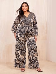 Curves Like These Black/White Long Sleeve Wrap Jumpsuit - Image 1 of 4