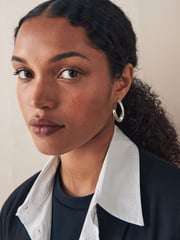 Silver Tone Twist Hoop Earrings - Image 1 of 4