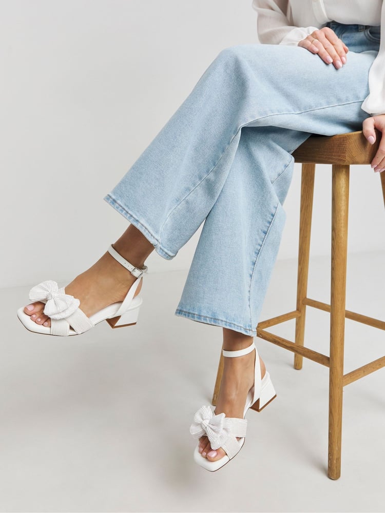 Simply Be White Double Bow Low Block Heels In Extra Wide Fit - Image 1 of 4 Simply Be White Double Bow Low Block Heels In Extra Wide Fit - Image 1 of 4