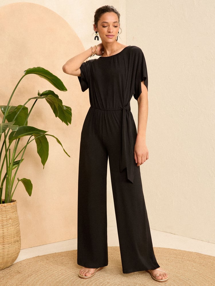 Love & Roses Black Wrap Jersey Jumpsuit - Image 1 of 4 Love & Roses Black Wrap Jersey Jumpsuit - Image 1 of 4