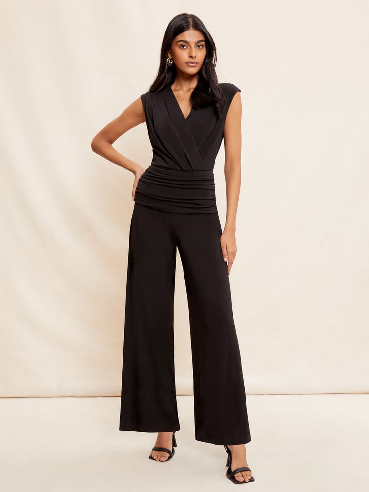 Friends Like These Black Ruche Waist Wrap Style Slinky Sleeveless Wide Leg Jumpsuit - Image 1 of 4 Friends Like These Black Ruche Waist Wrap Style Slinky Sleeveless Wide Leg Jumpsuit - Image 1 of 4
