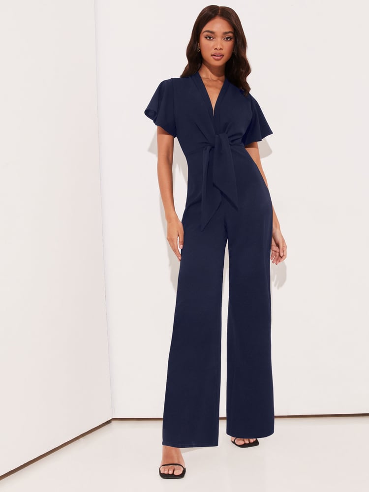 Lipsy Navy Blue Flutter Sleeve V Neck Tie Front Wide Leg Jumpsuit - Image 1 of 4 Lipsy Navy Blue Flutter Sleeve V Neck Tie Front Wide Leg Jumpsuit - Image 1 of 4
