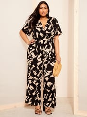 Curves Like These Black/White Flutter Sleeve Wide Leg Jumpsuit - Image 1 of 4