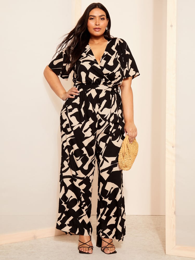 Curves Like These Black/White Flutter Sleeve Wide Leg Jumpsuit - Image 1 of 4